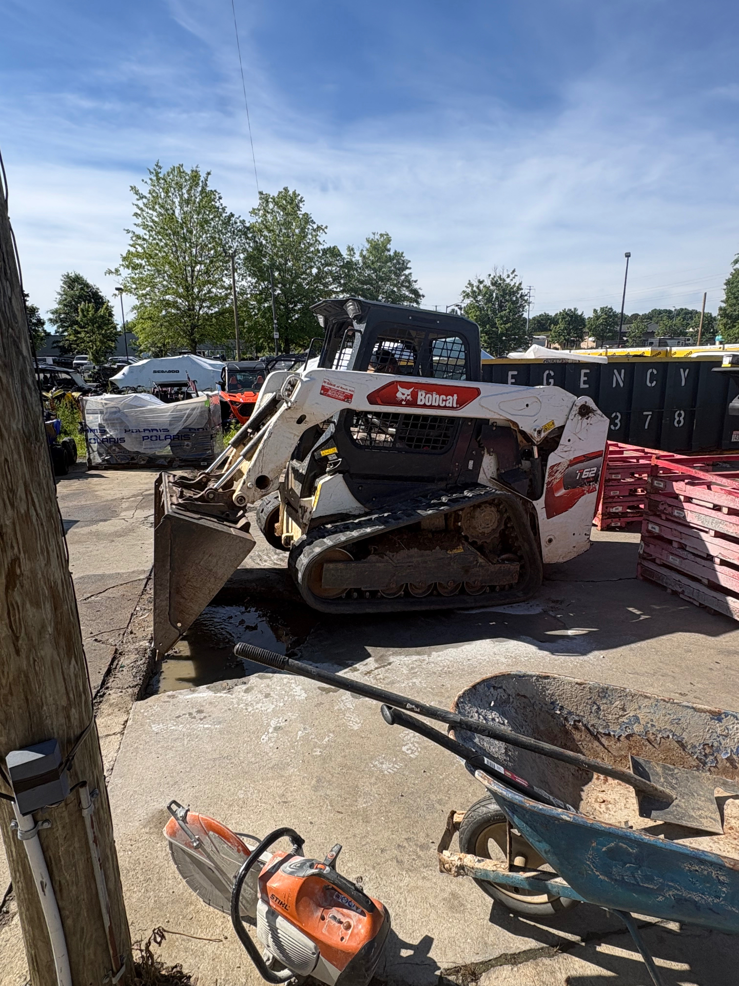 Compact equipment clearing brush and preparing a residential lot near Charlotte, NC